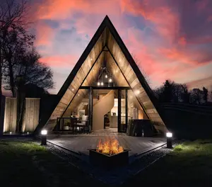 An A-Frame cabin for glamping in the evening