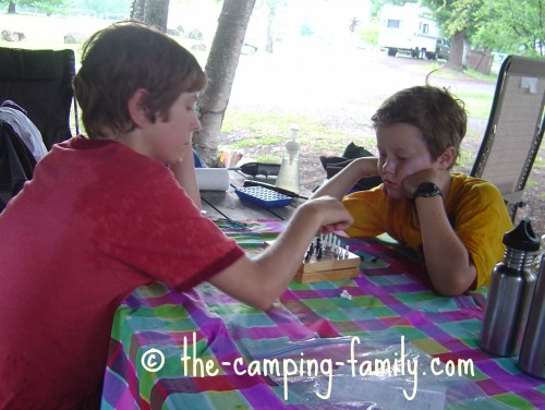 playing chess at the picnic table