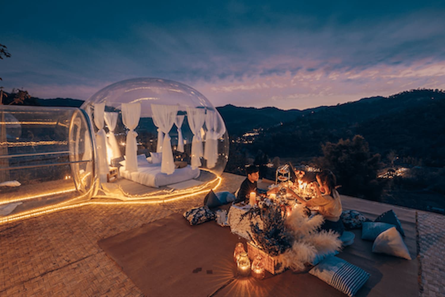 A bubble tent with a view at night