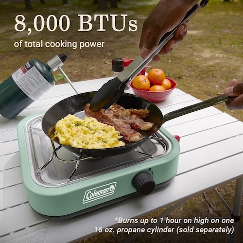 Coleman Single Burner camp stove with scrambled eggs and bacon in a frying pan