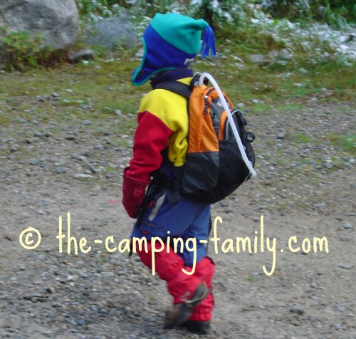 small boy with orange backpack