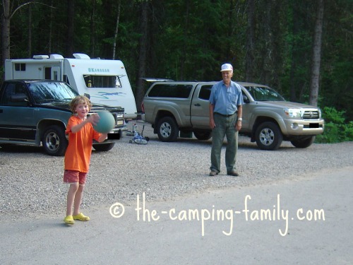 boy playing ball with Grandpa