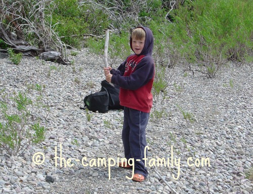 playing baseball with a stick