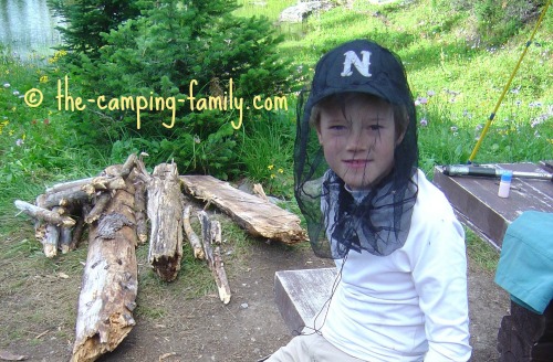 boy wearing mosquito headnet