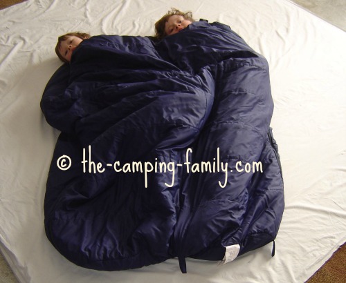 boys in sleeping bags zipped together