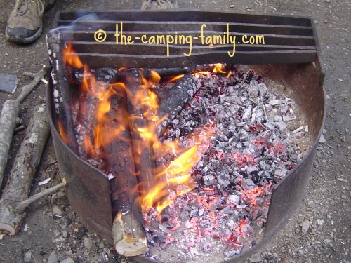 campfire with bed of coals on the side