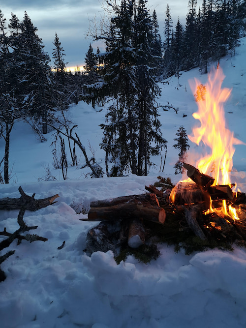 a campfire in the snow