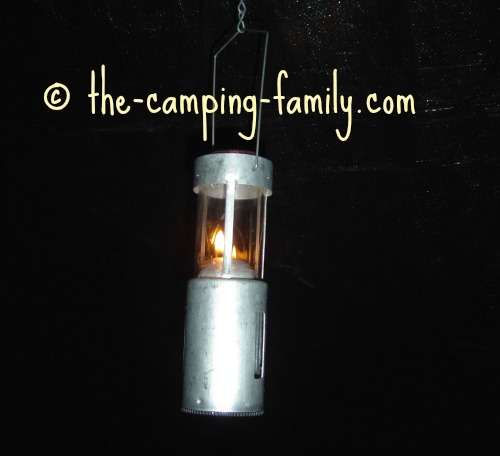 candle lantern hanging in the dark
