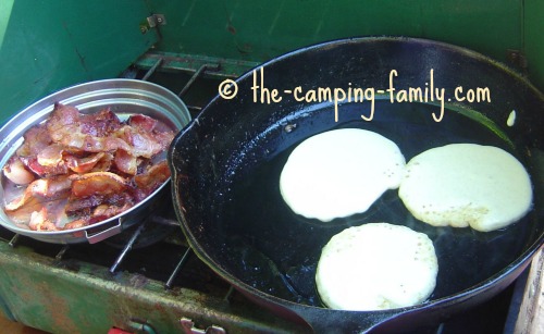 pancakes and bacon on camping stove