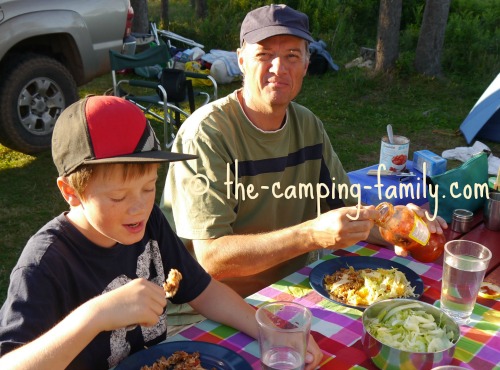 father and son at picnic table