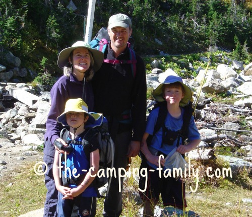 happy family with backpacks