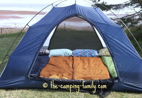 small tent with four sleeping bags on Thermarests