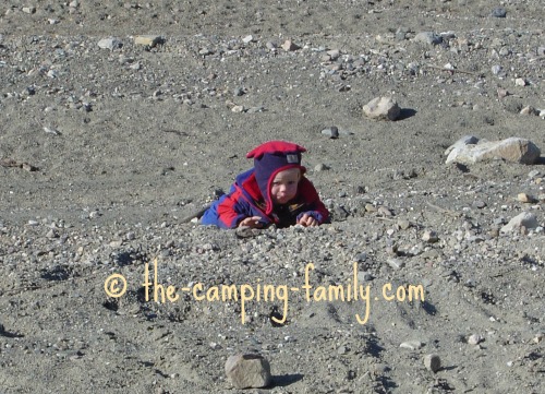 toddler crawling in the dirt