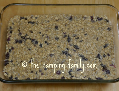 glass baking dish with granola bar mixture