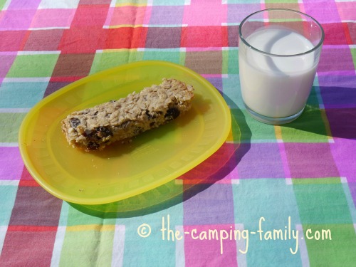 homemade granola bar with a glass of milk