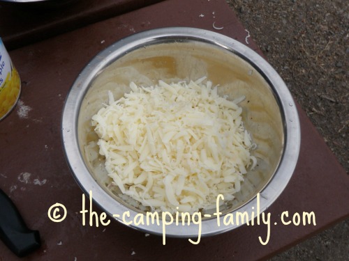 grated mozzarella cheese in bowl