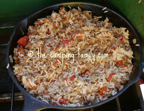 hamburger, rice, tomatoes and rice in skillet