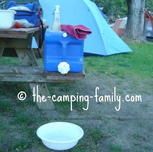 water jug, towel, soap pump and basin