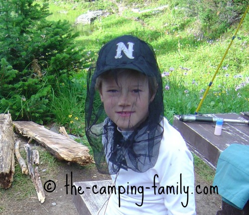 boy wearing bug head net