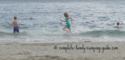 kids playing in waves