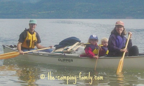 family in loaded canoe