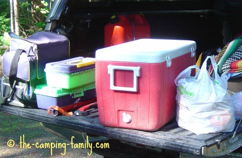 cooler and gear in back of truck