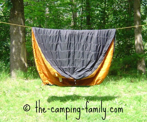 synthetic sleeping bag on clothesline