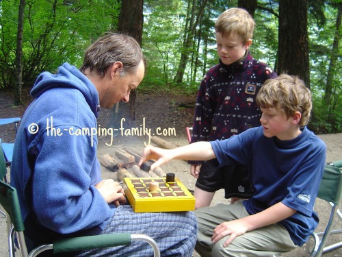 father and sons playing the Gobblet game