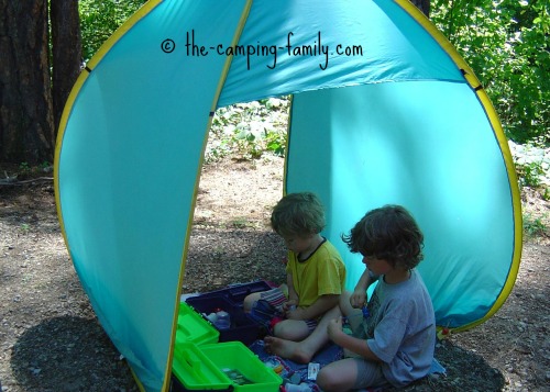 boys in pop up tent shelter