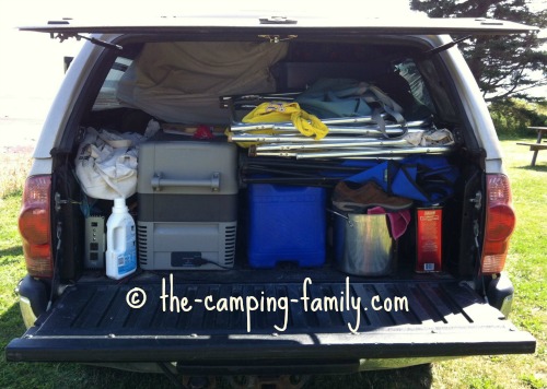camping fridge in a packed pickup truck
