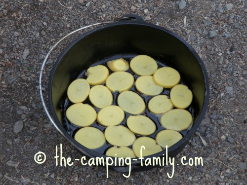 sliced potatoes in Dutch oven