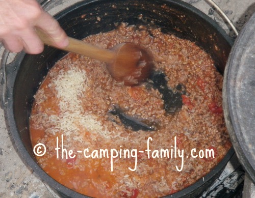 adding rice to Dutch oven