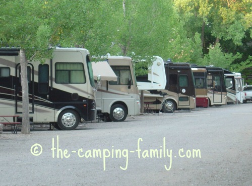 row of motorhomes in campground