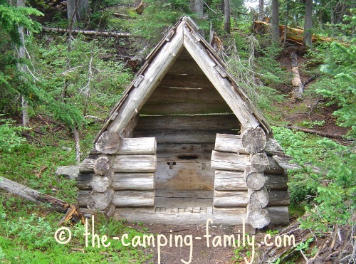 rustic outhouse in the woods