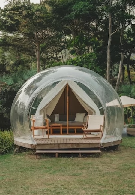A bubble tent with a small canvas tent inside