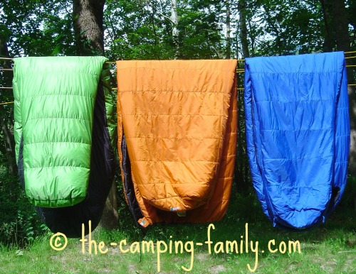 three sleeping bags on the clothesline