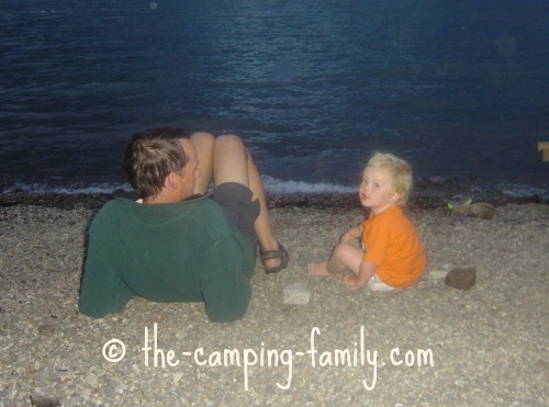 toddler and dad on the beach at night