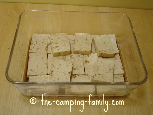 tofu and marinade in glass baking dish