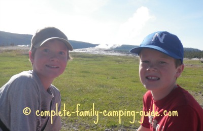 boys with Old Faithful behind them