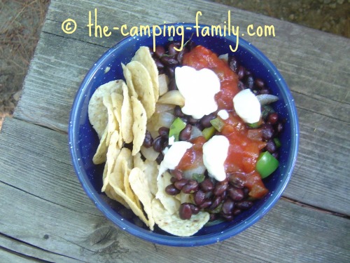 Balsamic Black Beans in a bowl with salsa and sour cream