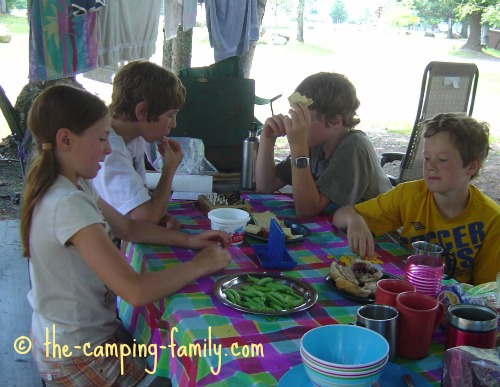 kids playing board games at the picnic table