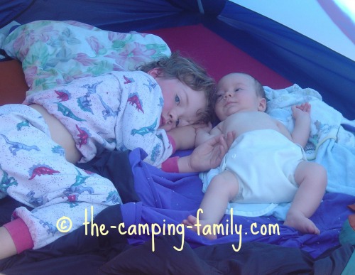 two small boys in a tent