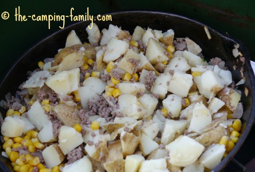 ground beef, potatoes and corn in skillet