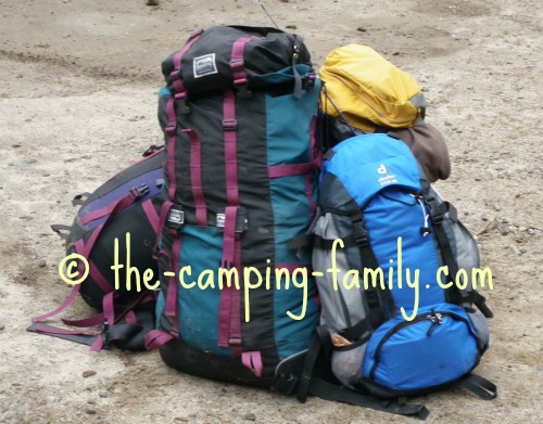 pile of loaded backpacks