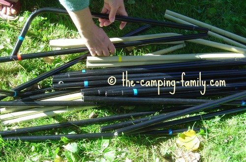 pile of color coded tent poles