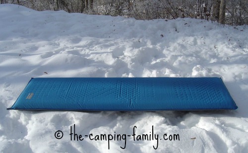 self inflating sleeping bag on the snow