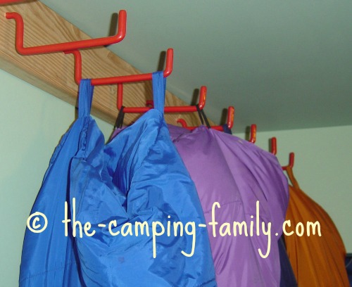 sleeping bags hanging from loops